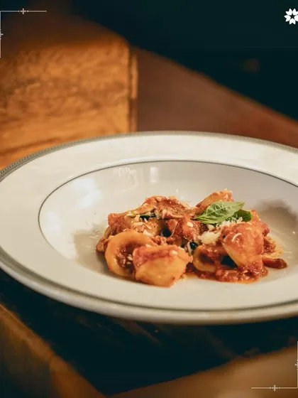 Hand folded Tortellini in a classic Pappa al Pomodoro sauce. This dish, served at a destination wedding, combines traditional Italian technique with refined plating, honouring our contemporary approach to heritage recipes.