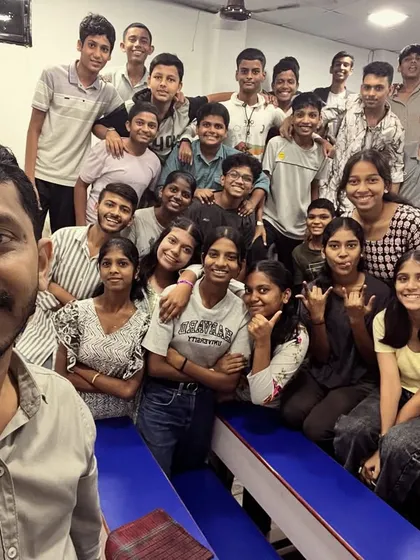 A selfie capturing the happy faces of students and their mentor, all participating in the grey-themed Navratri celebration.