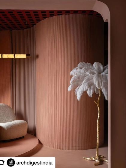 A detail shot of the feather floor lamp against a backdrop of fluted wall panels and a unique grid ceiling. This combination of textures was key to achieving the immersive feel of the store.