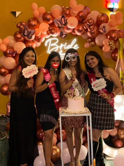 The bride tribe having fun with props in front of the bachelorette party backdrop. My setups are designed to encourage fun and memorable photos.