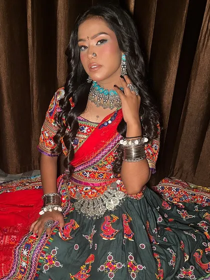 A full view of our vibrant Navratri look. The colorful traditional attire is paired with bold makeup, including a pop of blue under the eyes, and authentic silver jewelry.