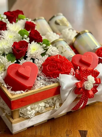 This was a custom hamper I created for a client, and I just loved how it turned out. It features a mix of fresh red and white flowers alongside my heart-shaped and rose-shaped candles, making it a truly special and romantic gift.