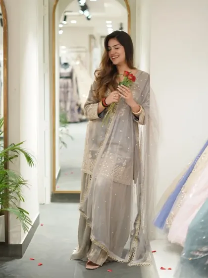Soft hues, this outfit, and a little bit of magic. A lovely grey sharara set for a subtle and elegant look.