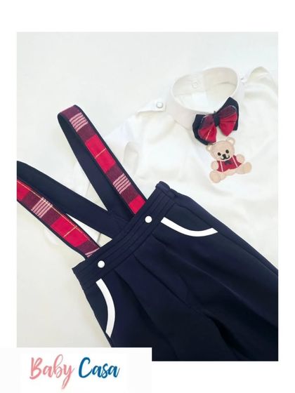A closer look at the details of our classic suspender set. The plaid bow tie and teddy bear embroidery add a playful touch to this dapper outfit for little boys.