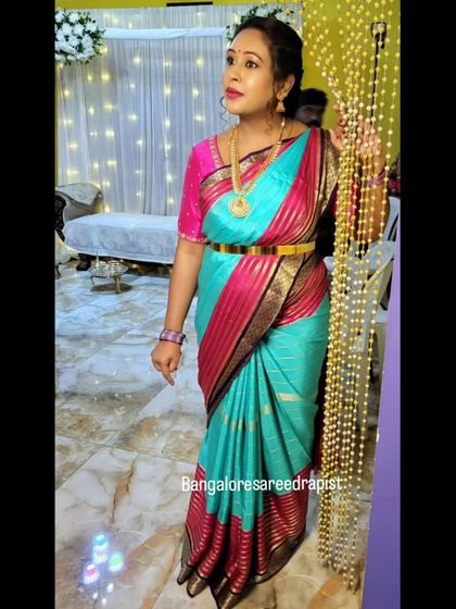A quick and elegant draping for mom-to-be Arpita. The Mysore silk saree is styled with a waistbelt to accentuate the drape while ensuring she is comfortable during her baby shower.