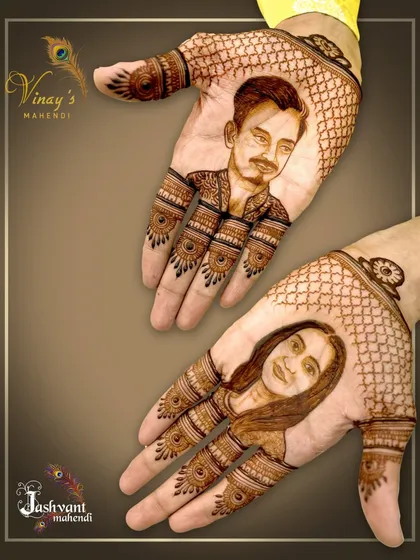 A closer look at the incredible detail in this groom's couple portrait mehndi.
