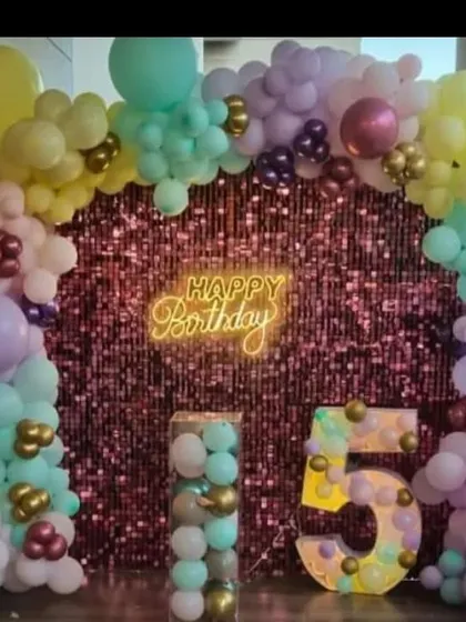 The same pink sequin wall and pastel balloon setup, showing its versatility for different parties.