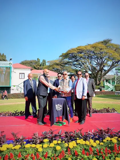 Presenting the K.N. Chennabasappa Memorial Trophy.