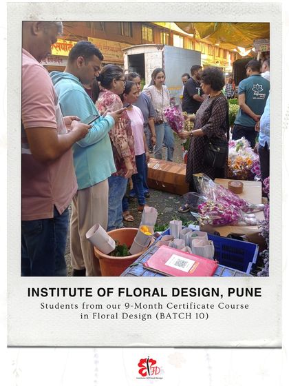 An instructor guides students through the bustling flower market, teaching them how to select the best blooms for their arrangements. This is practical learning at its best.
