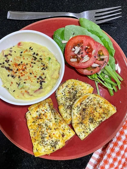Here's another example of a perfect meal to break a fast. Pan-fried paneer with herbs, a side of fresh avocado mash, and some greens. This combination of protein and healthy fats is exactly what your body needs after fasting.