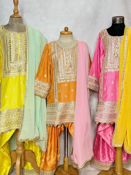 A front-on view of the Pimmo sets, highlighting the rich colors and detailed embroidery.