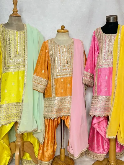 A front-on view of the Pimmo sets, highlighting the rich colors and detailed embroidery.