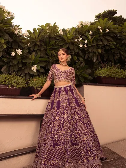 Presenting "Noor" in a rich purple lehenga. I styled this with delicate gold jewelry and a floral bun for an elegant and regal look, perfect for a Sangeet or reception.
