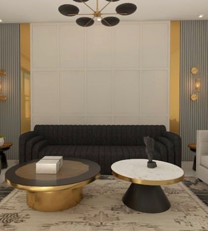 A living room wall design idea featuring a combination of grey and white panels with golden accents for a touch of luxury.