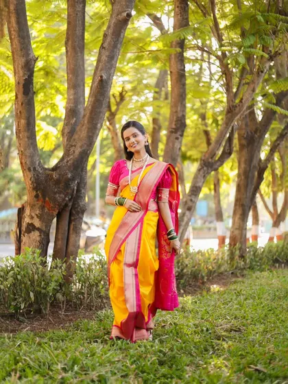 Another beautiful full-length shot, showing the elegant drape of the Nauvari saree.