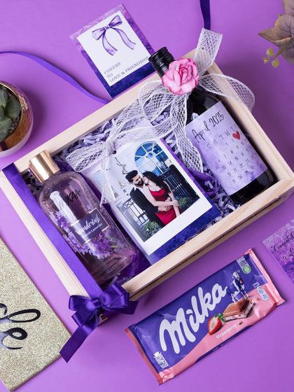A bride-to-be hamper in a lovely lavender theme. This gift includes a personalized photo, a custom-labeled wine bottle marking the wedding month, and pampering essentials.