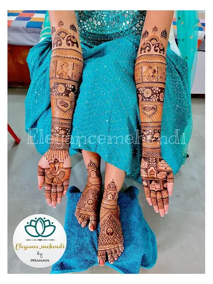 A complete bridal mehendi set, including intricate designs for both hands and feet. The hand design features portraits and elephants.