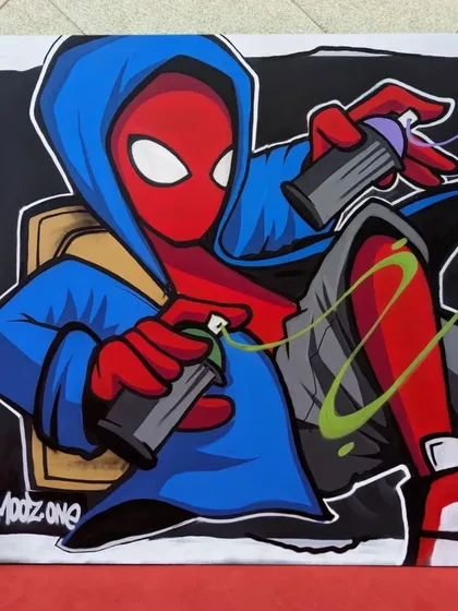 My finished Spider-Man piece from a live painting session at Bangalore Comic-Con. It shows Spidey in a hoodie, holding spray cans, blending my world with his.