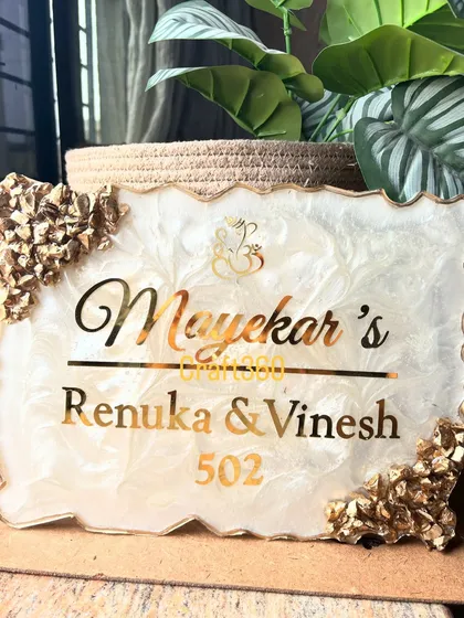 A classic and elegant nameplate design that is one of my most requested styles. I created this piece with a white and gold marble effect, accented with geode crystals, to give the entrance a feeling of warmth and luxury.