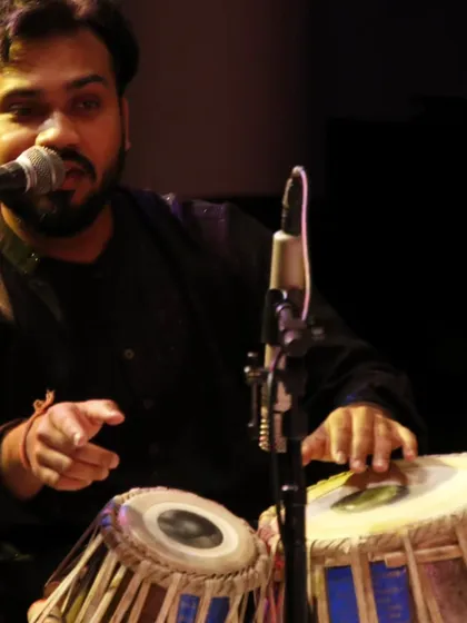 A moment during my performance in Portland, USA. The microphone captures the sound, but the expression conveys the feeling.