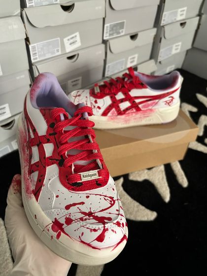 A detailed shot of the custom "Stree 2" ASICS, showing the "Knickgasm" lace lock.