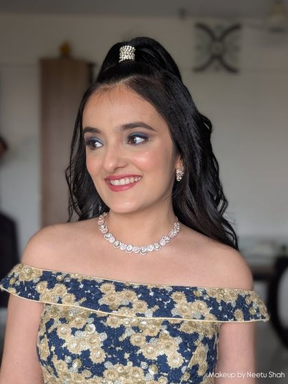 A close-up of this party-ready makeup, showing the blended smokey eye and radiant skin. It's a look that's both glamorous and age-appropriate.