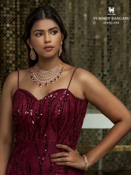 For this jewelry shoot, I paired a stunning ruby and diamond necklace set with a deep maroon gown. The color coordination creates a rich, monochromatic look that feels incredibly luxurious and elegant.