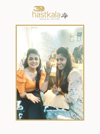 Another picture from the feature, this one with a client. Customizing designs based on my client's personality and story is the core of my work.