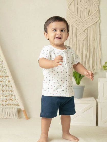 My boho-themed sessions use natural textures like macrame, wood, and greenery to create a calm and earthy setting that beautifully complements your child's simple joy.