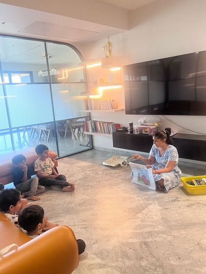 Another view of our unplugged coding session. The children are completely engaged in the story, getting ready to tackle a hands-on challenge that will teach them about sequencing and loops.