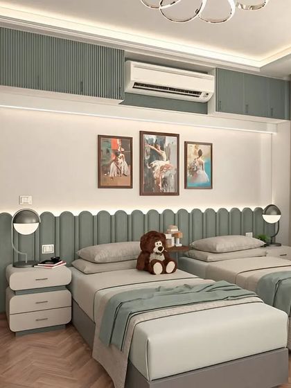 A serene and stylish shared bedroom for two children. The design uses a calming color palette, scalloped wall details, and individual bedside tables to create a comfortable and personalized space.