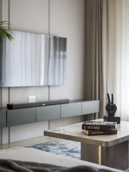 The exquisite marble-topped center table was customized on-site. It's a nod to modern sophistication and serves as a beautiful anchor for the living room seating area.