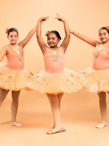 Dressed as blooming flowers, these dancers are ready for 'The Waltz of the Flowers' from The Nutcracker. Their poses capture the delicate beauty of nature's cycle, from bud to full bloom.
