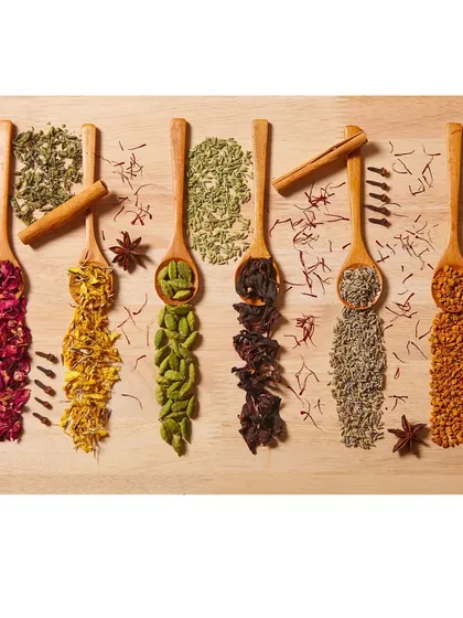 A detailed flat lay showcasing the natural ingredients of a tea blend. This type of ingredient photography helps communicate the quality and flavor profile of the product before the customer even tastes it.