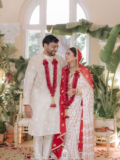 The couple shares a look of love during their simple and beautiful home wedding ceremony.