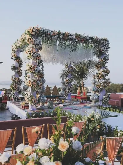 For this beachside wedding, I designed a mandap that felt both grand and organic. The structure is covered in an abundance of pastel florals, creating a romantic frame against the stunning ocean view.