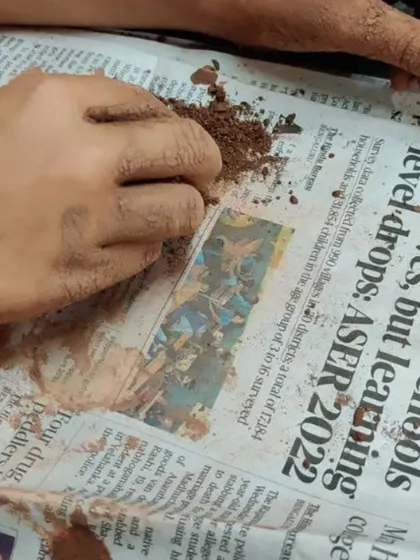 The process is just as important as the product. Here, a child explores the texture of dry clay, a sensory experience that is both calming and educational. There is no right or wrong way to play.