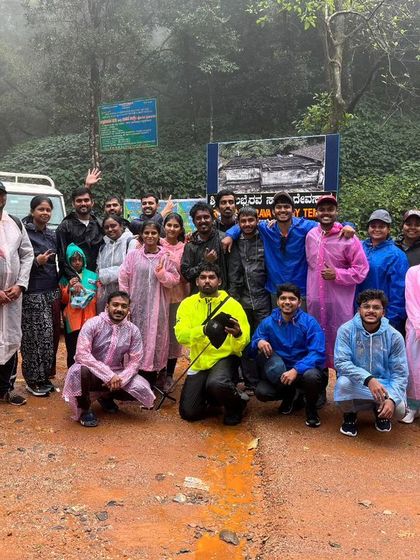 Our trekking batch posing at the entrance of the Bandaje Falls trail, ready for an adventure in their raincoats.