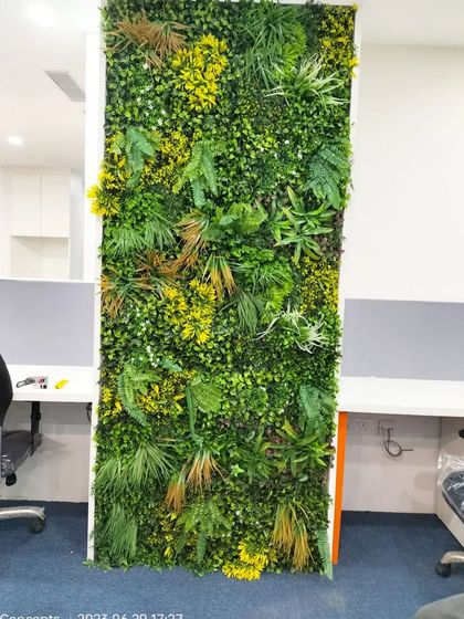 Another angle of the completed office green wall, showing how it fits perfectly between workstations. This maintenance-free solution offers all the aesthetic benefits of a living wall with none of the hassle.