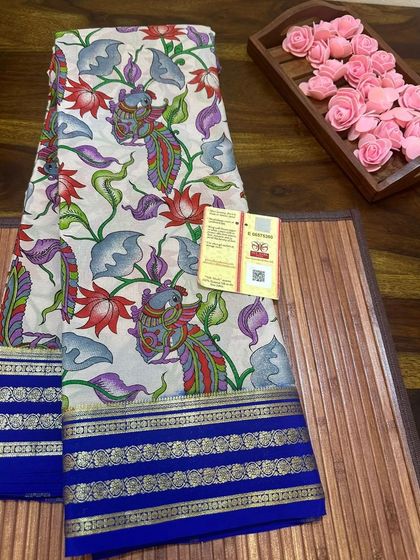 A beautiful Annapakshi (divine swan) Kalamkari print on a Mysore silk saree with a blue border.