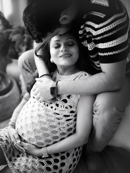 A joyful and intimate moment between a couple, rendered in beautiful black and white. It highlights their expressions and the happiness they share.