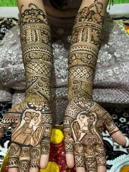 Another angle of the full bridal arms, showcasing the intricate jaali and band work that frames the couple's portraits.
