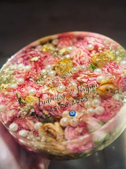 I love how the names and date seem to float above the preserved flowers in this piece. It’s a beautiful way to personalize your wedding keepsake.