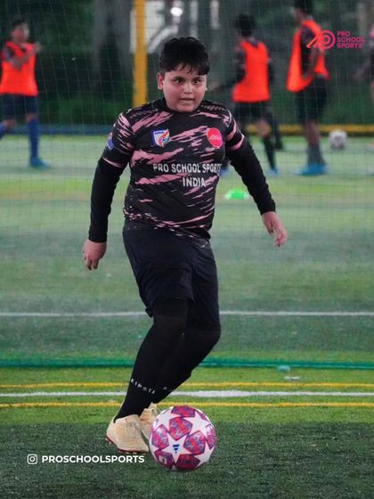 A player practices ball control, a fundamental skill for every position on the field.