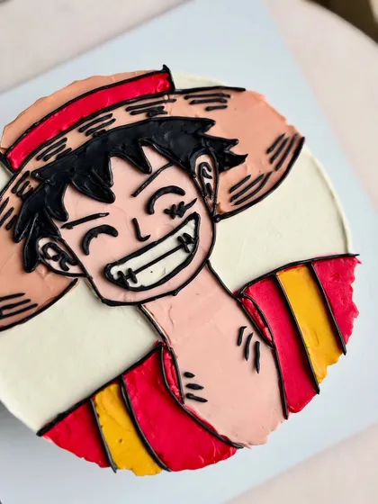 A close-up on Luffy's signature grin, showcasing the detailed line work I can achieve with buttercream.