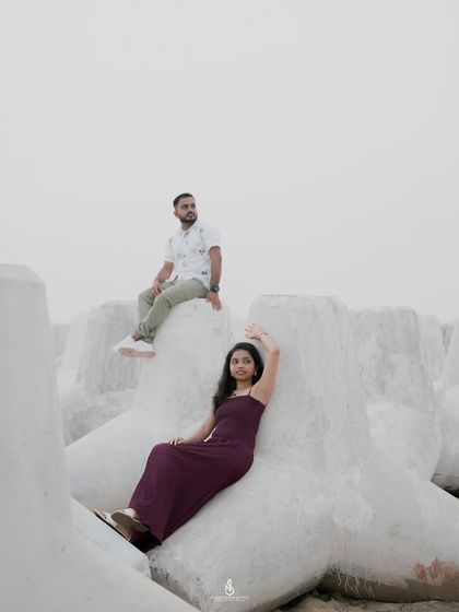 A creative pose using the large tetrapods as a unique backdrop. We can explore different angles and compositions to make your beach photoshoot stand out.