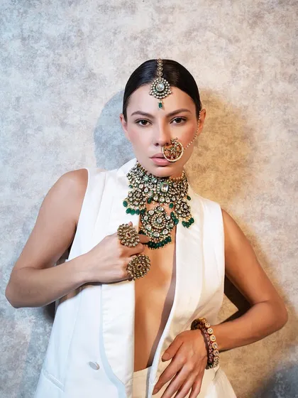 My collection isn't just about lehengas. I offer stunning jewellery sets for rent that can elevate any outfit. Here, a modern, high-fashion styling shows how my traditional Kundan and Polki sets can be used to create a bold, contemporary statement.