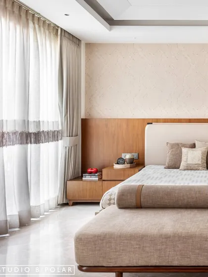 The custom curtains feature a subtle fringe detail, adding another layer of handcrafted texture to the room. Every detail in this space was chosen to contribute to a peaceful and cozy atmosphere.