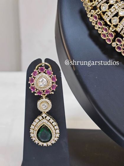 The matching earrings are designed to be statement pieces on their own.