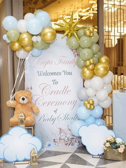 The personalized welcome sign for the 'A Star is Born' cradle ceremony, adorned with balloons and cloud cutouts, setting the celestial theme from the moment guests arrive.